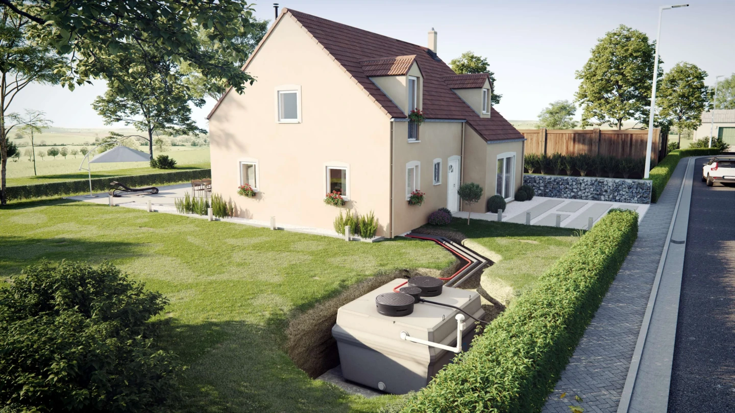 Filtre compact x-perco® FLEX avec poste de relevage intégré installé dans le jardin d’une maison individuelle