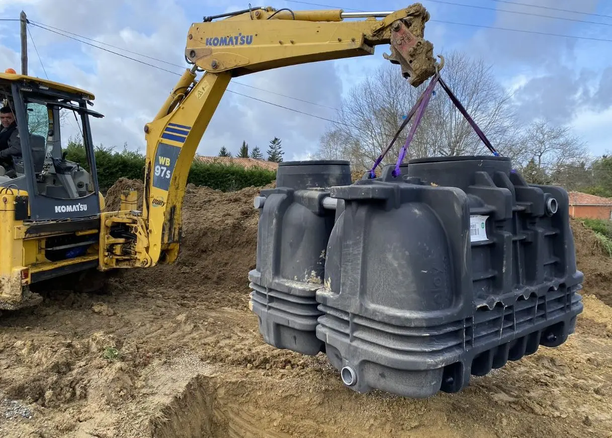 placement par une machine d'une cuve x-perco dans une résidence